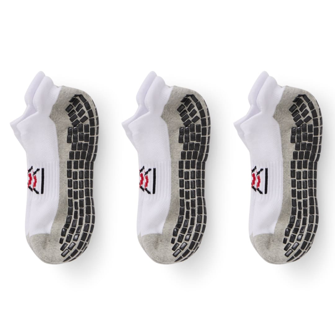 Three pairs of socks with textured sole design on a white background