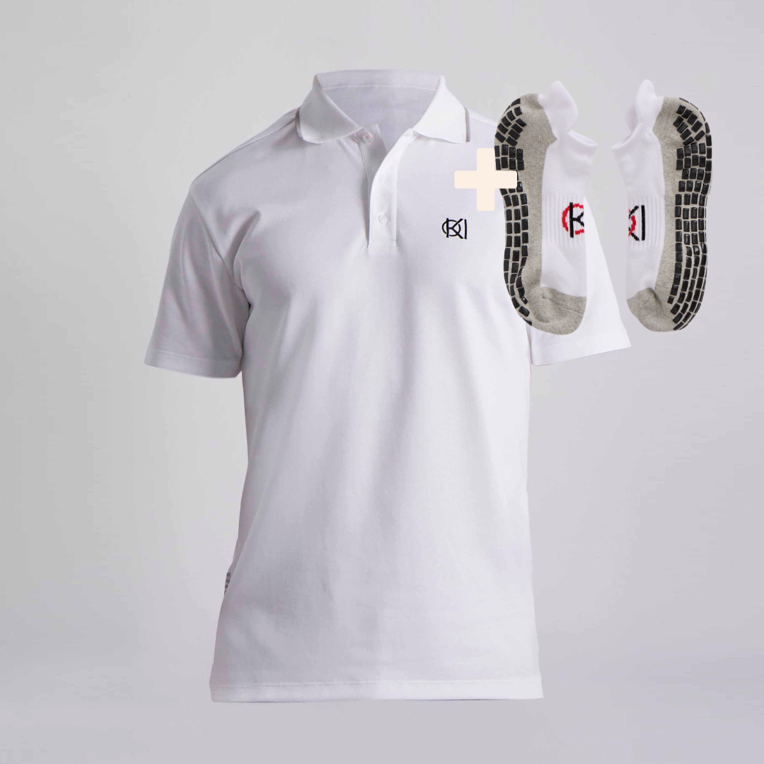 White polo shirt with a logo and two pairs of golf socks on a light grey background