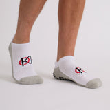 Mens white ankle golf socks on sunny UK fairway – lightweight and supportive