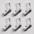 Six pairs of white socks with black and gray accents and Koi logo on a light gray background