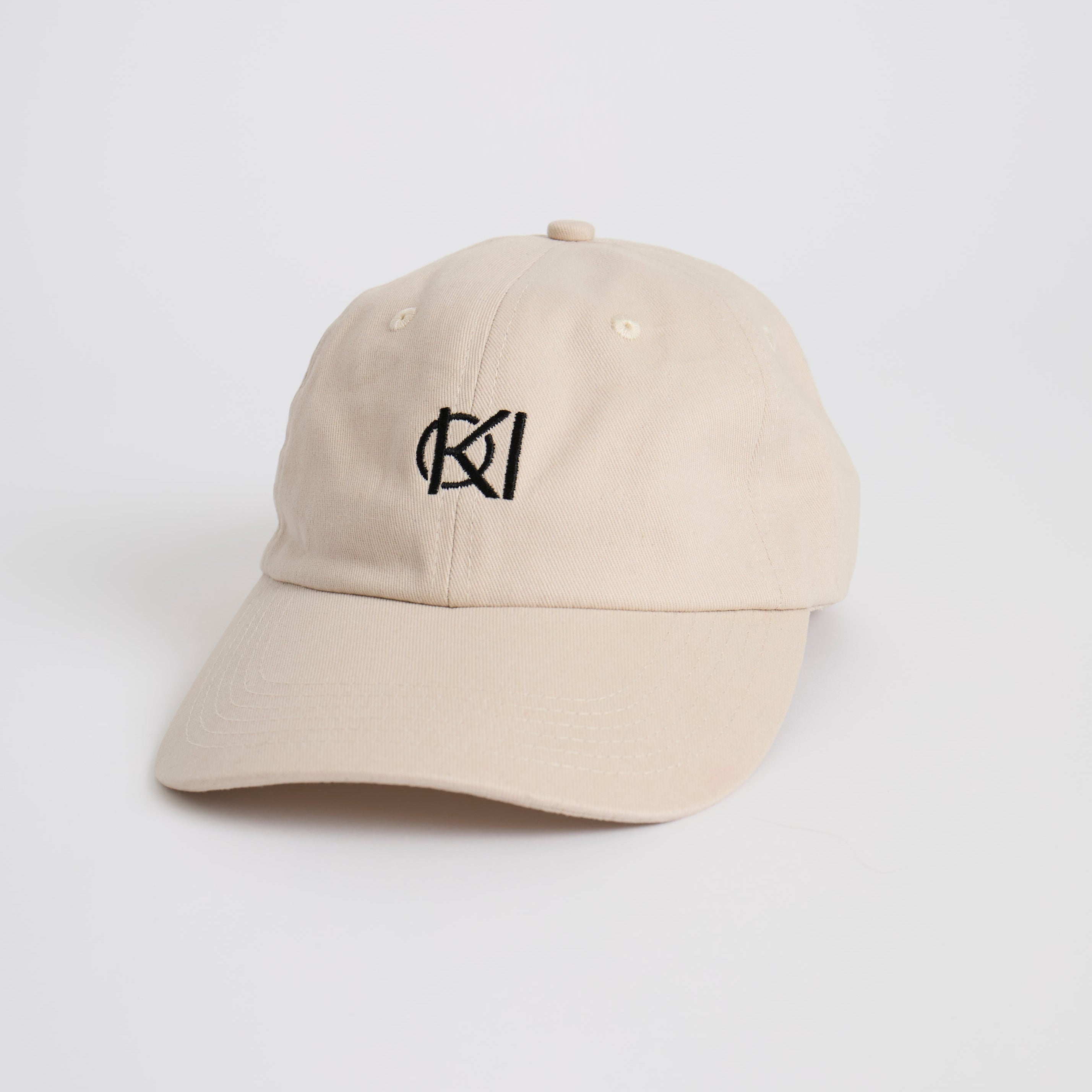 Beige golf cap with a black logo on a white background