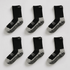 Six pairs of black socks with gray toes and heels on a white background