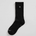 Black sock with a logo on a light gray background