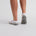 Close-up of white ankle mens golf socks – ribbed arch support and cushioned sole