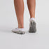 Close-up of white ankle mens golf socks – ribbed arch support and cushioned sole