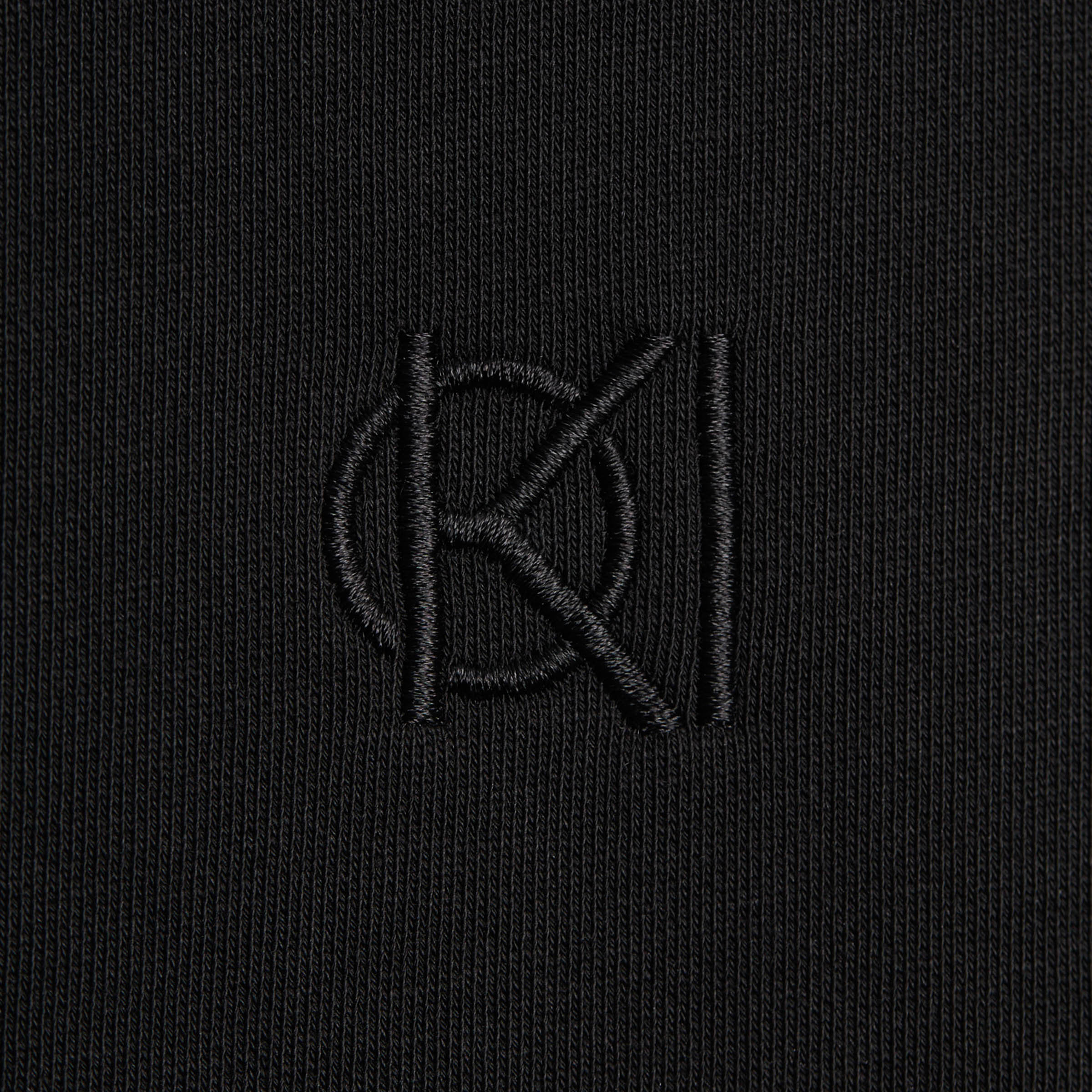Koi Golf logo on sweater